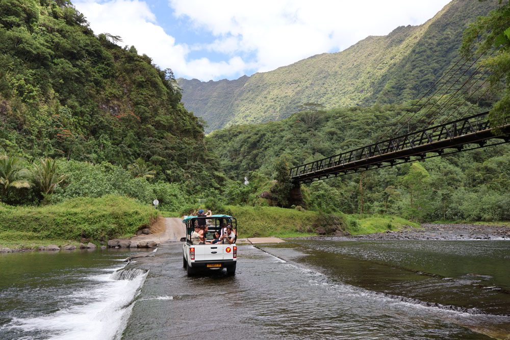 crossing river in Papenoo Valley - Tahiti - French Polynesia