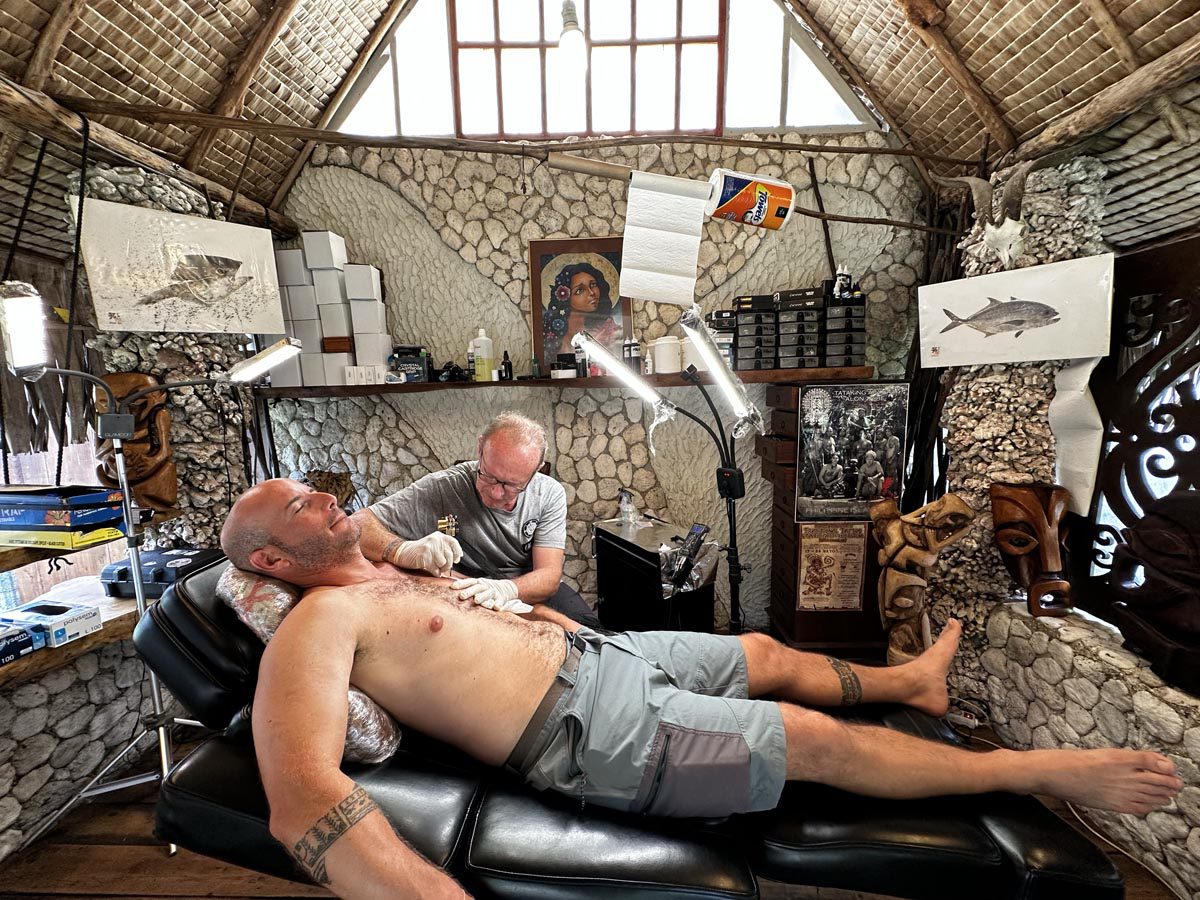 Avichai getting a tattoo in Moorea