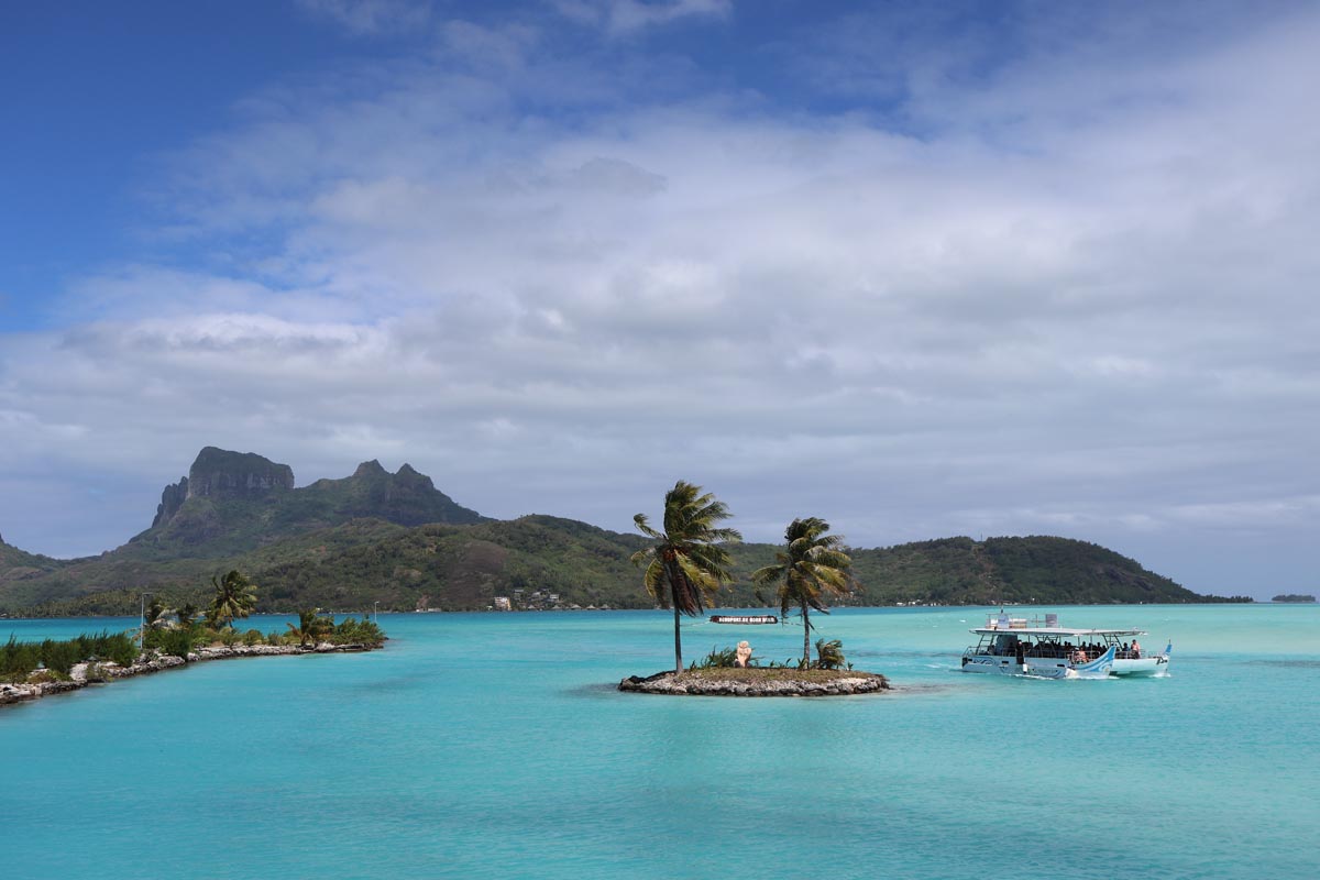 Bora Bora airport welcome sign in the lagoon