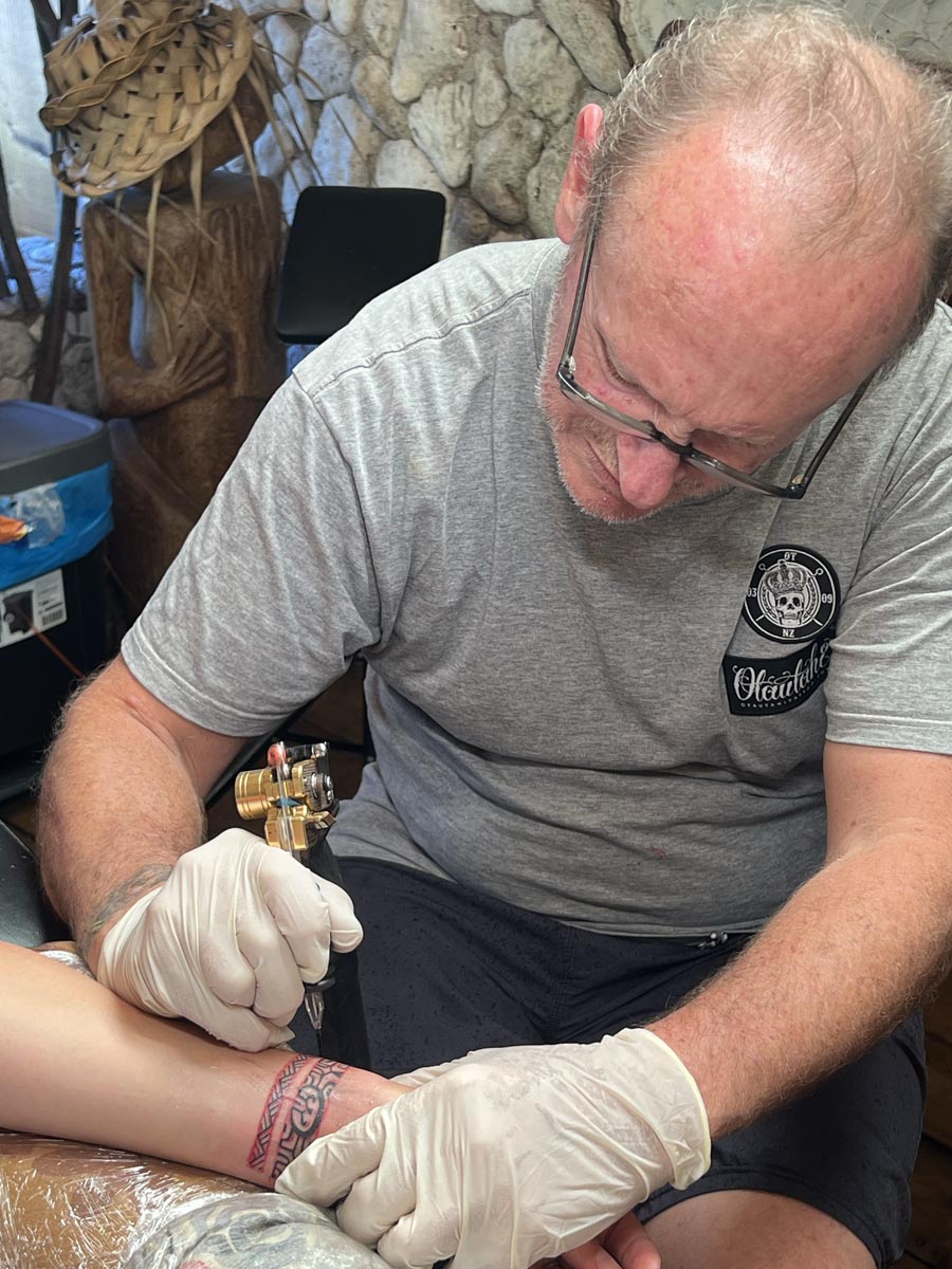 Ella getting a tattoo in Moorea - closeup