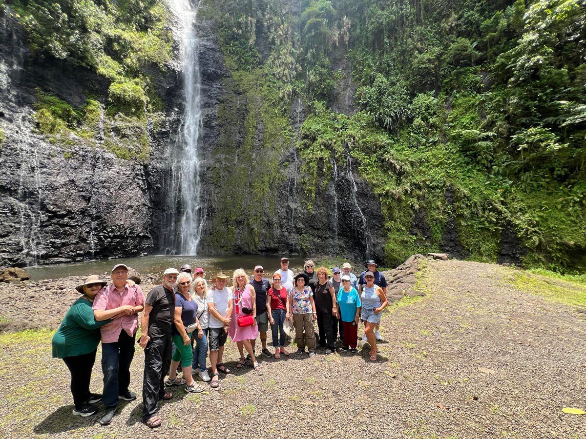 Group picture in Tahiti's Fa'aruma'i Waterfalls