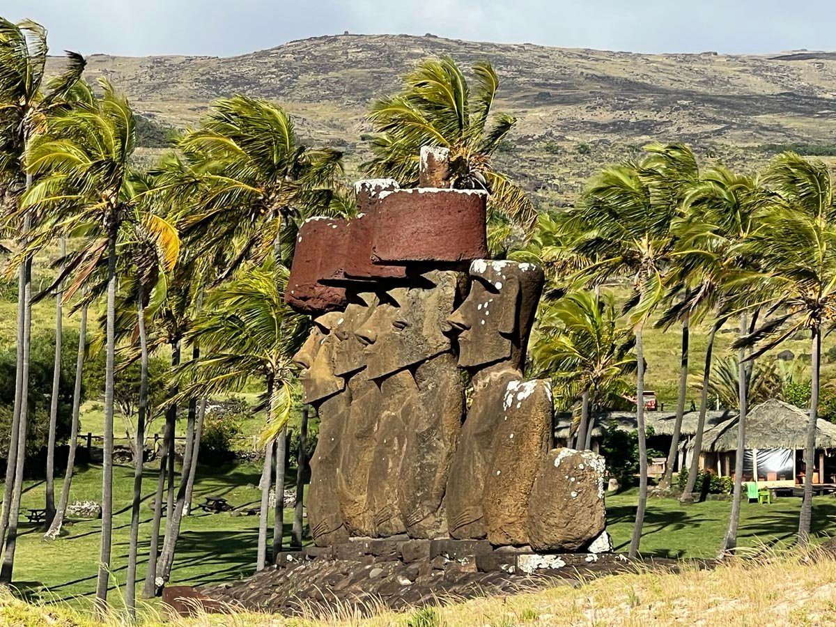 Profile view of moai statues in ahu nau nau Easter Island