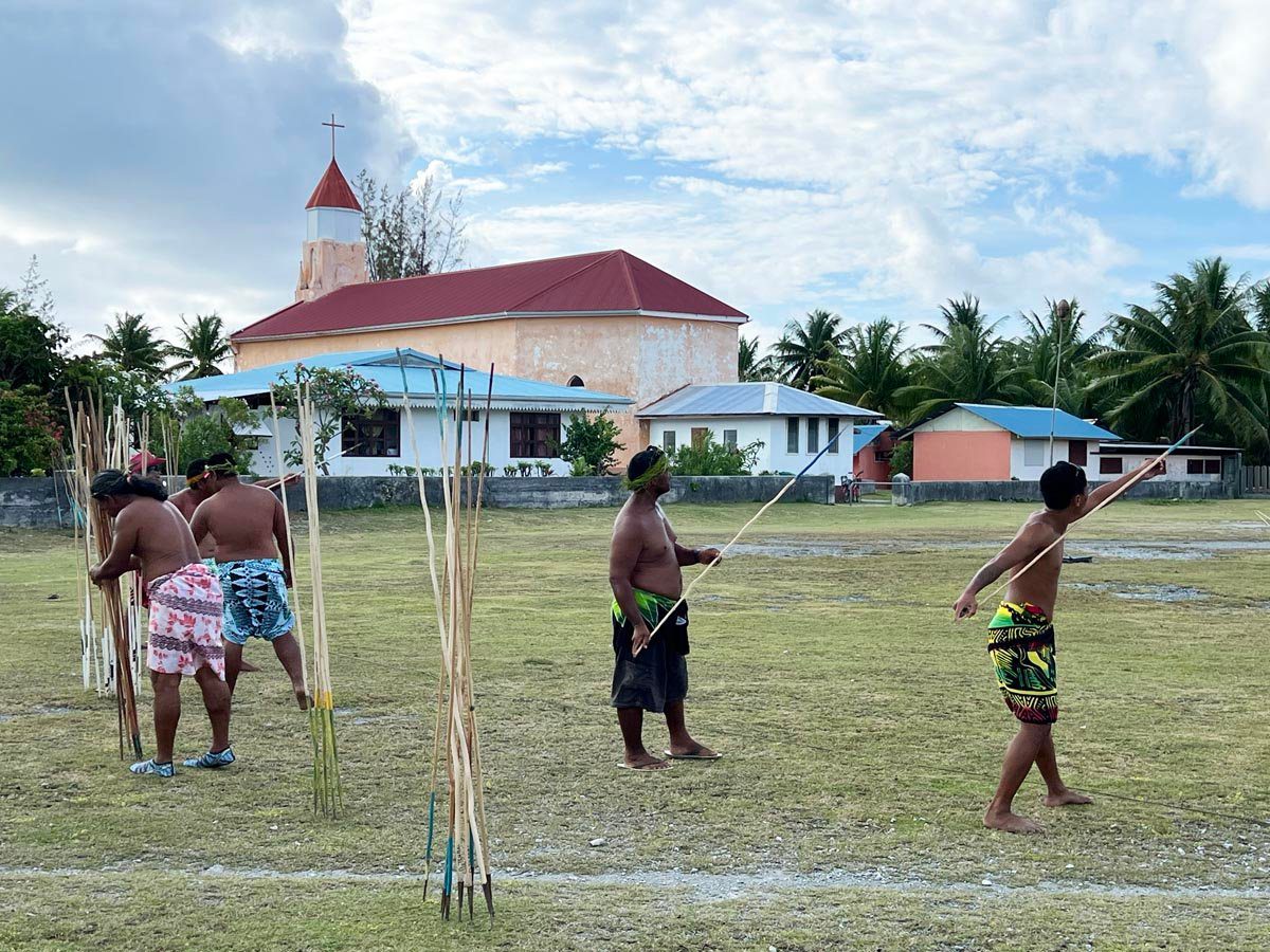 locals tossing javelin in Anaa